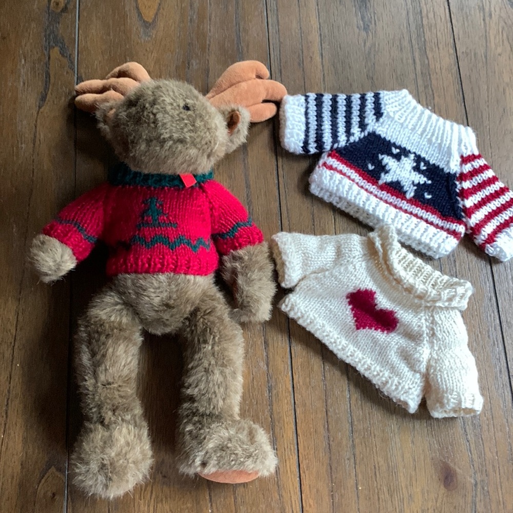 The Boyds Collection Stuffed Moose with 3 holiday sweaters